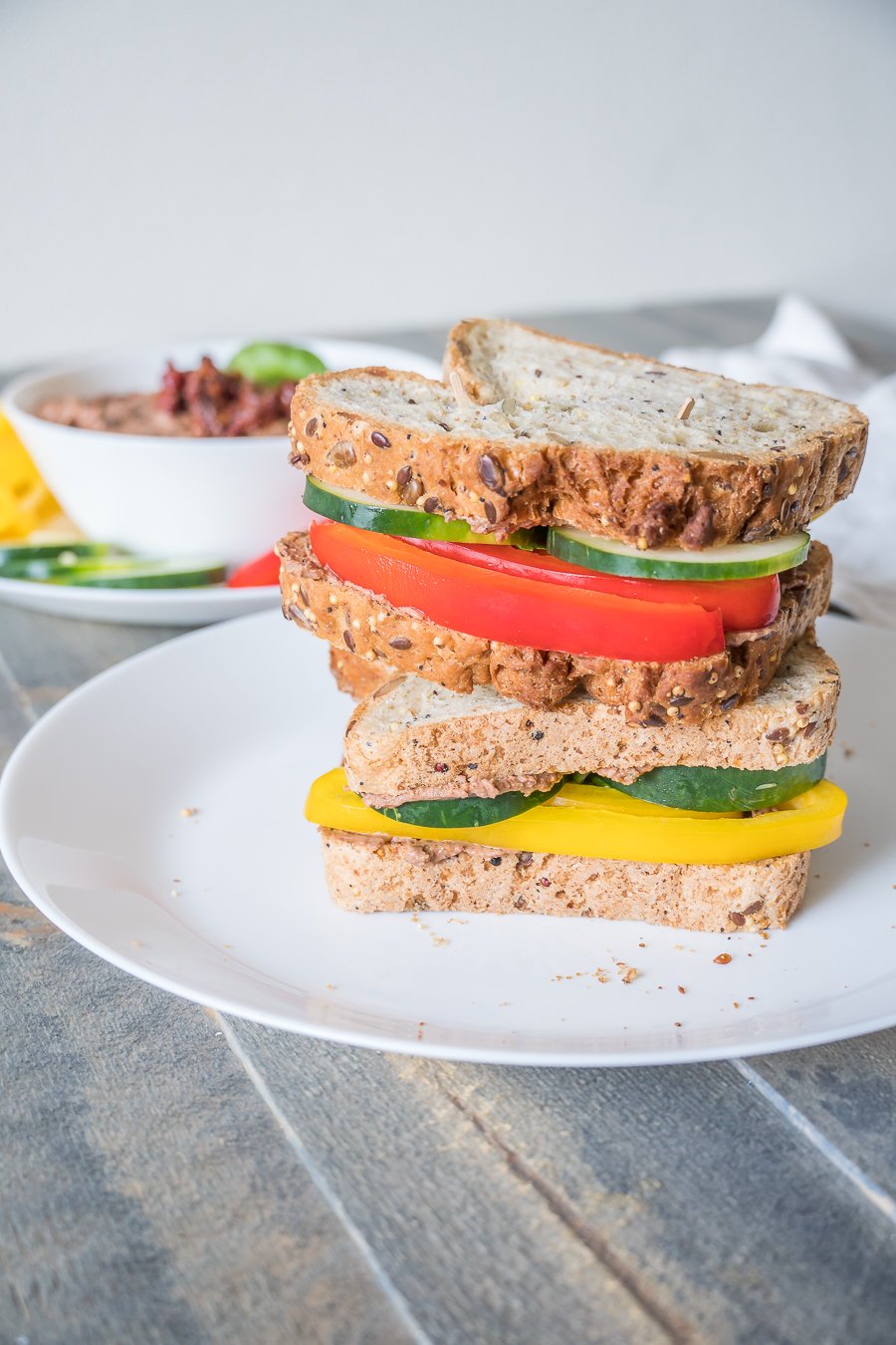 Two stacked veggie and hummus sandwiches ready-to-go!